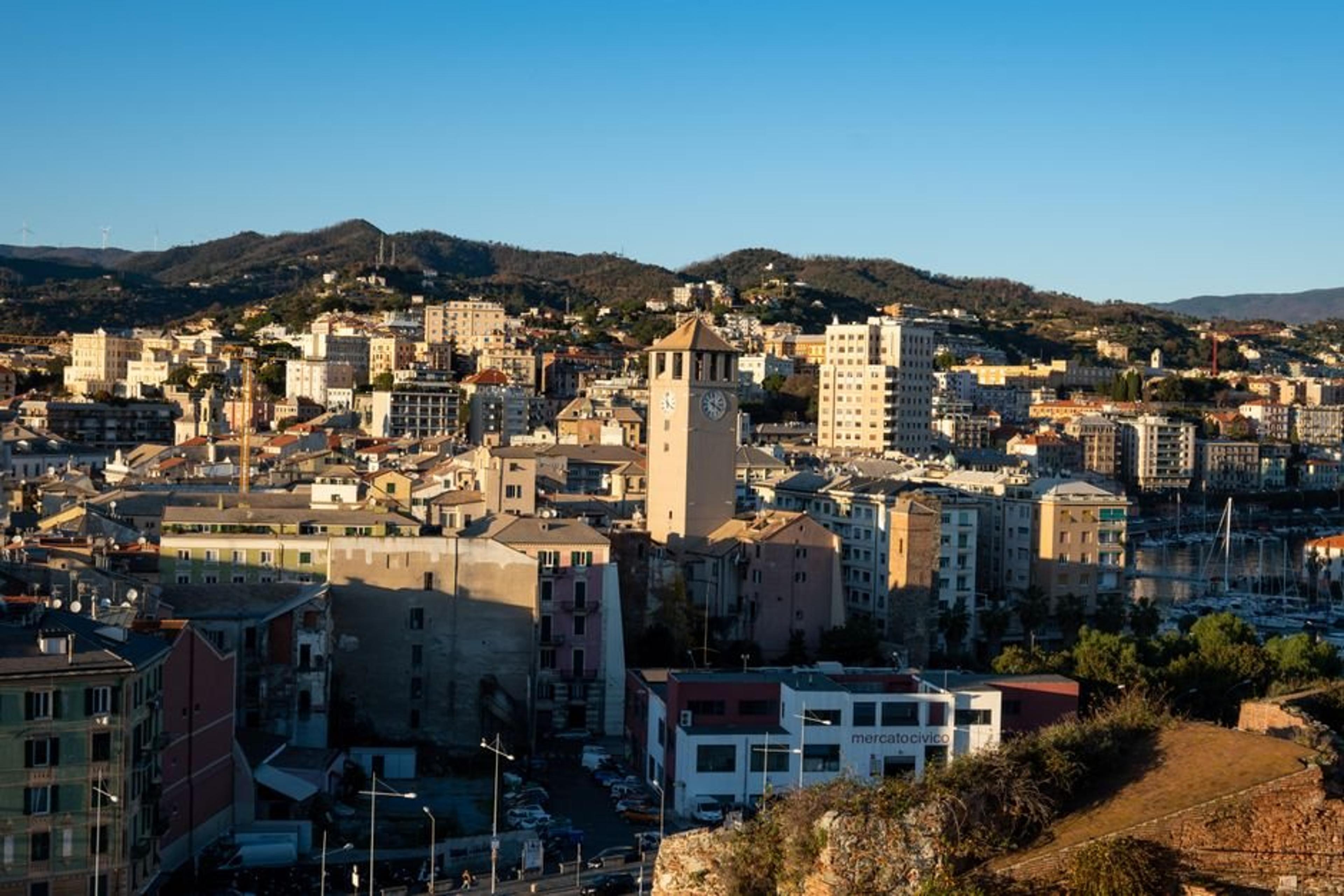 Aerial view of the picturesque city of Savona, Liguria, Italy, bathed in daylight.