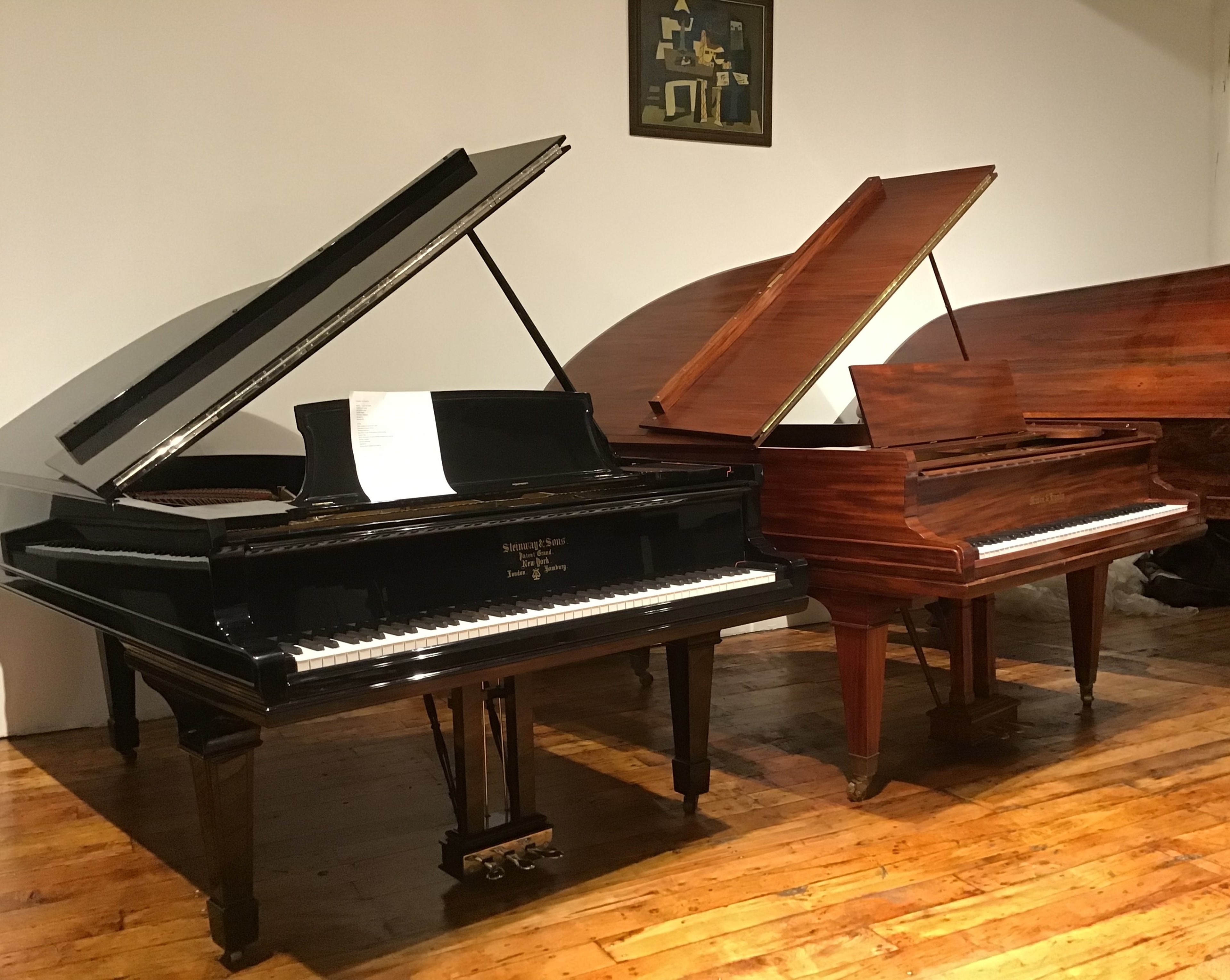 A showroom with Steinway & Sons and Mason and Hamlin Grand piano.