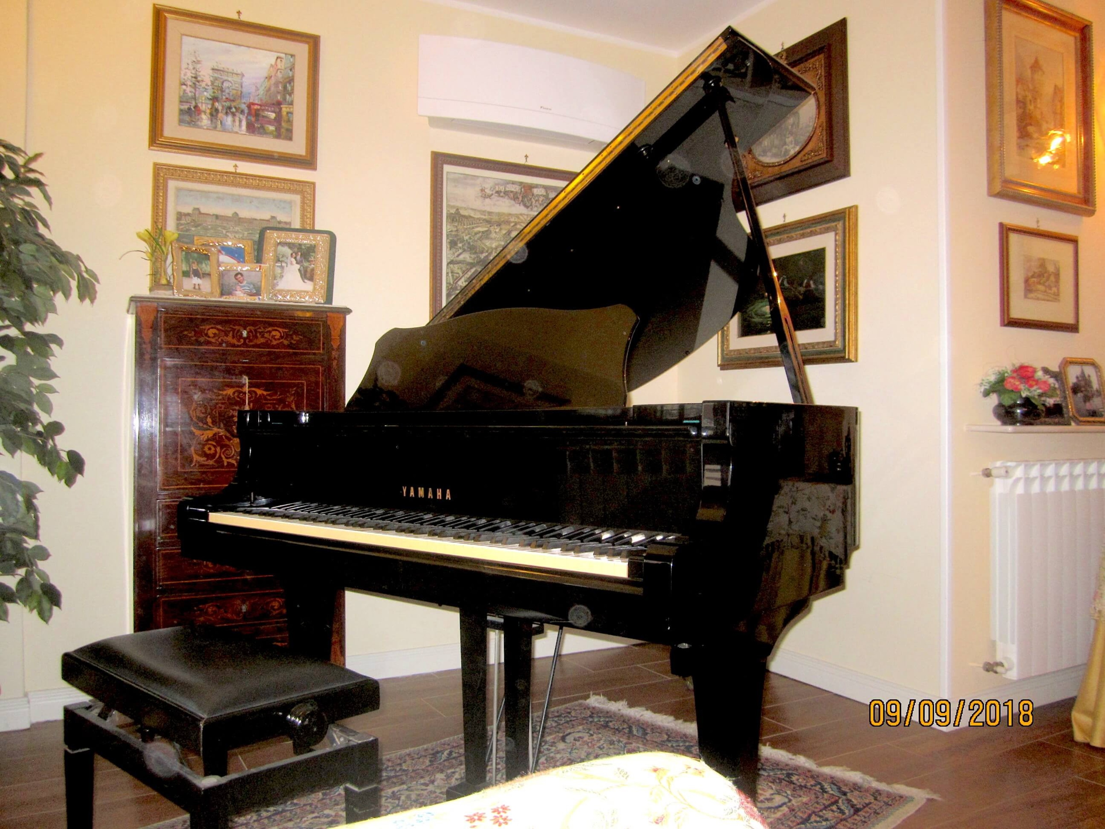 Beautiful Yamaha grand piano in bright room — photo 2
