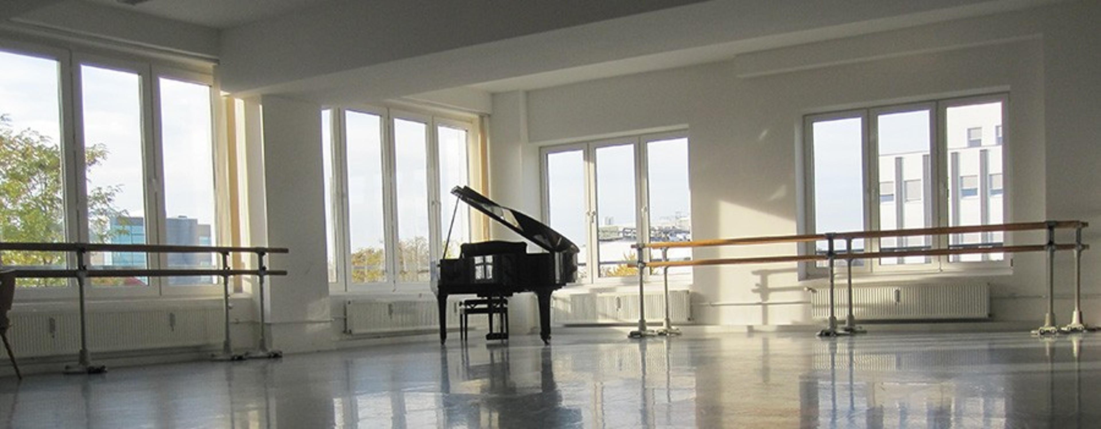 Bright hall with grand piano and mirror front