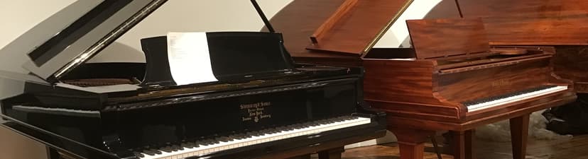 A showroom with Steinway & Sons and Mason and Hamlin Grand piano.